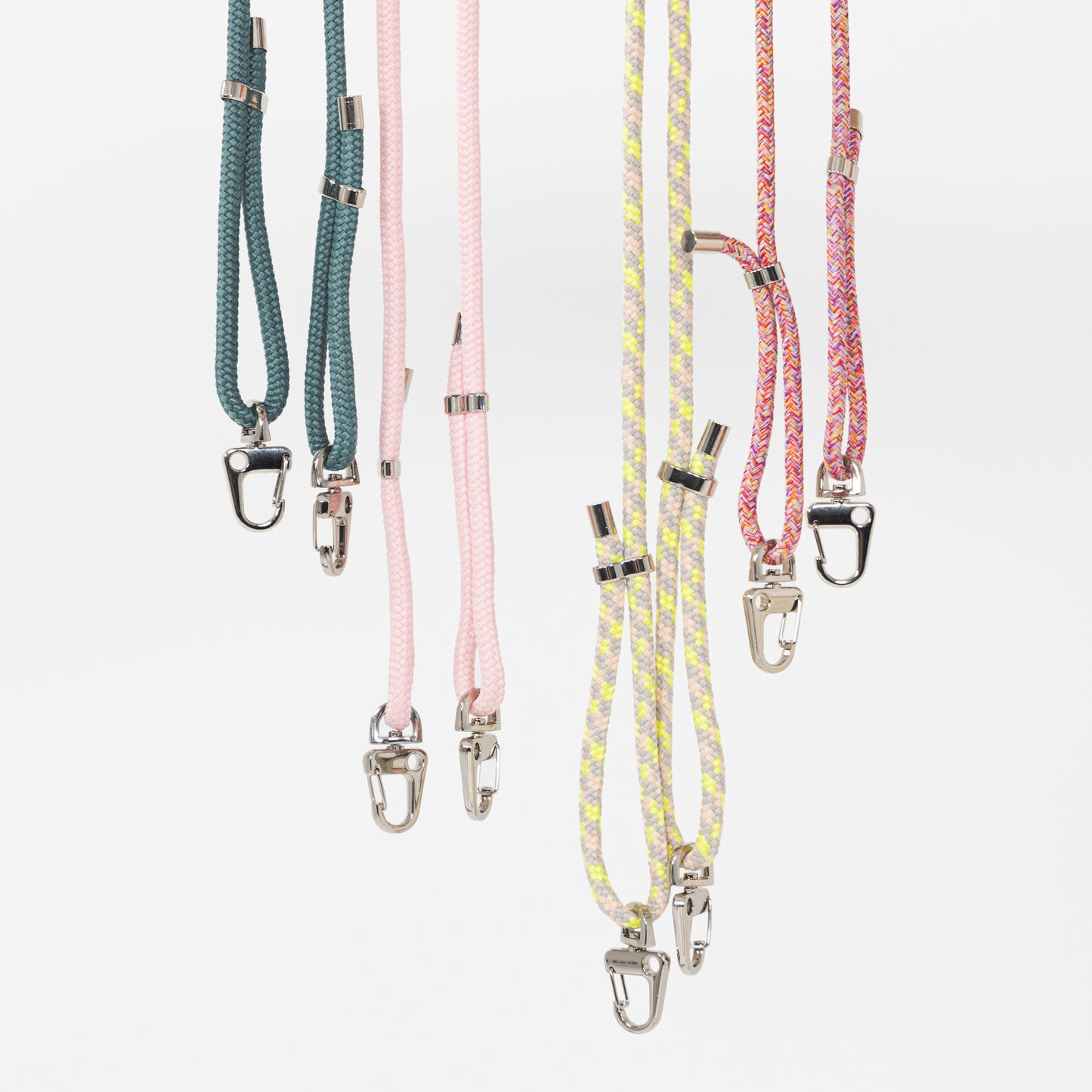 All crossbody phone cords hanging together with no phone cases attached