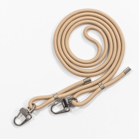 Crossbody phone cord tapioca coiled flat lay