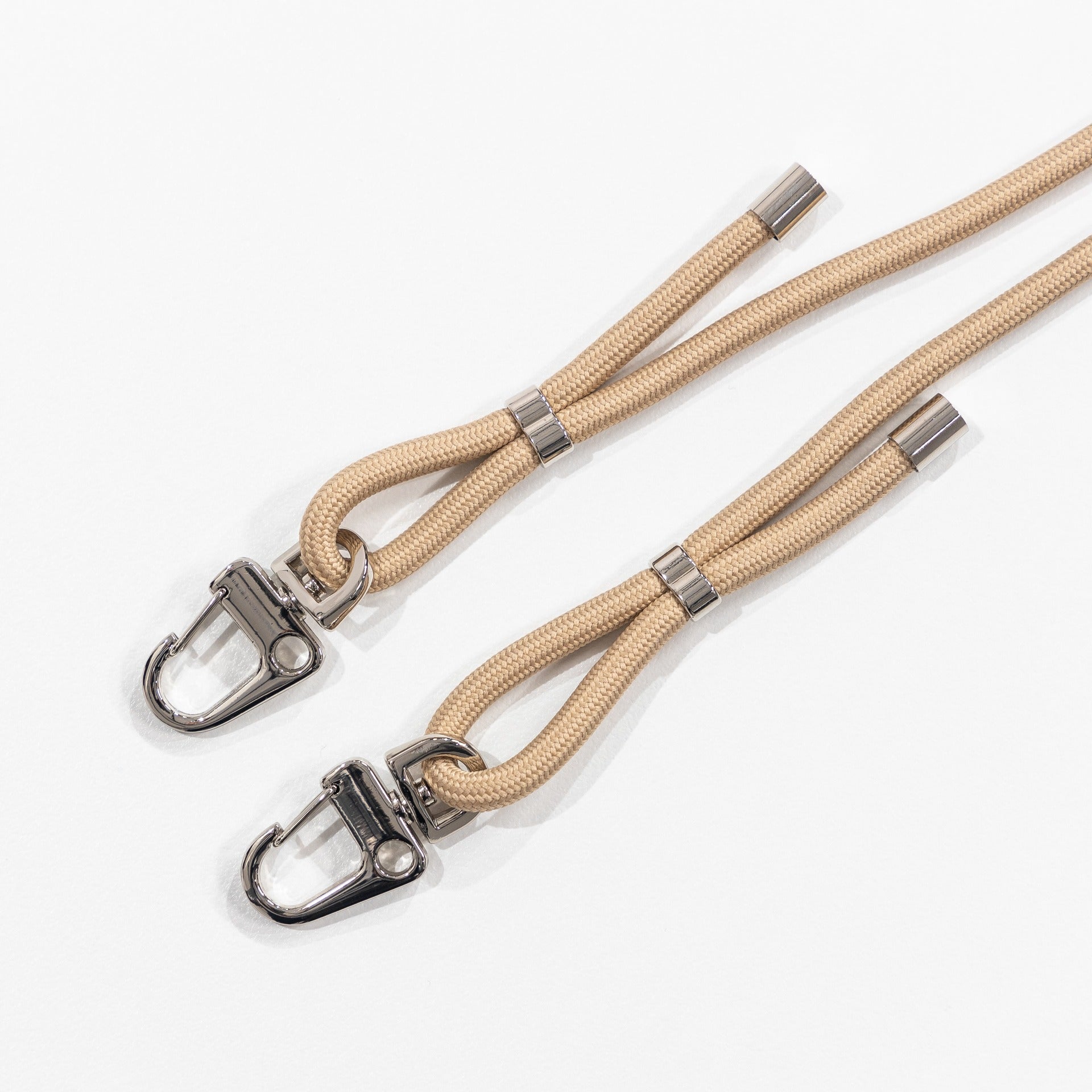 Crossbody phone cord with tapioca flat lay