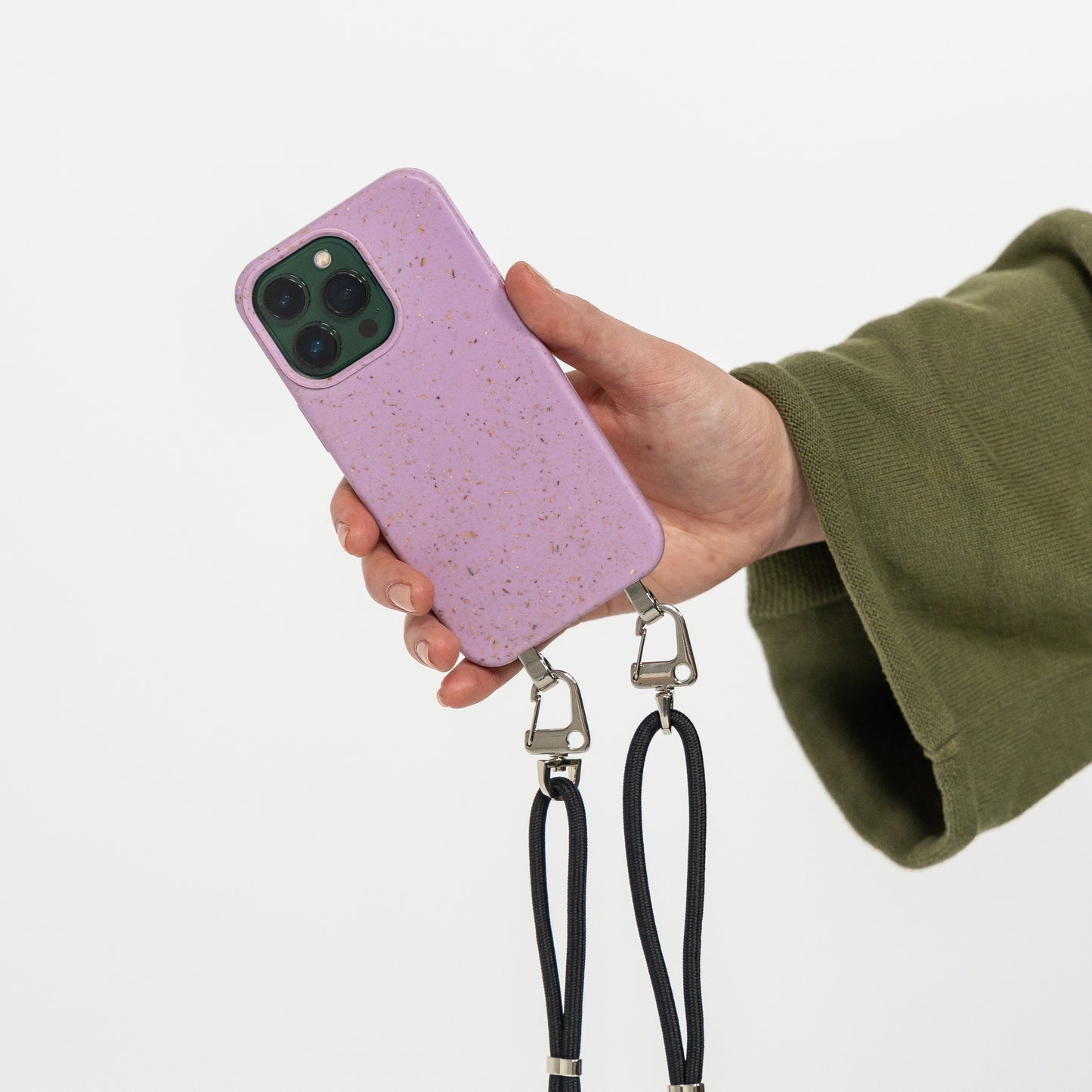 Lavender crossbody phone case being held with black cord attached 
