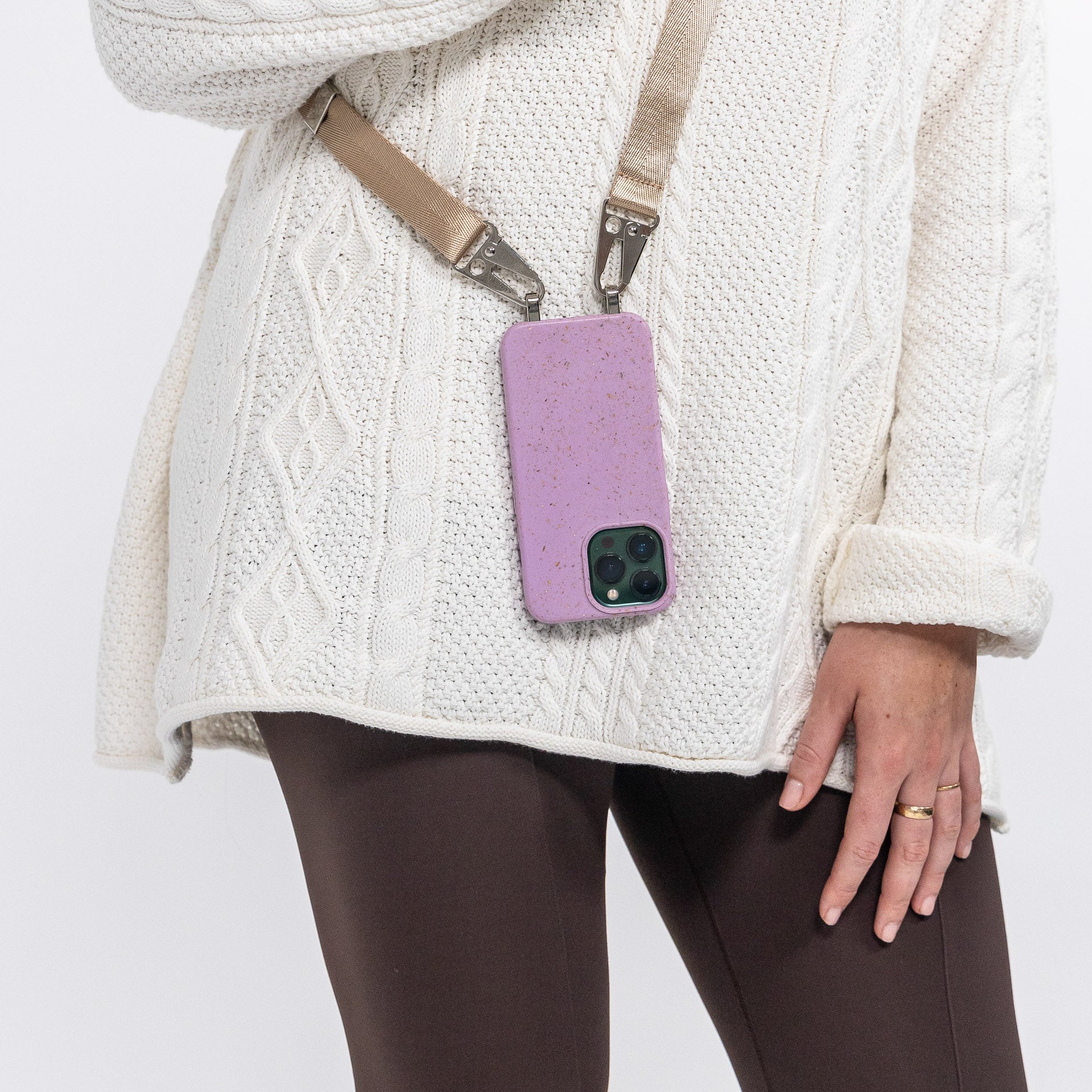 Lavender crossbody phone case with latte phone strap over shoulder 