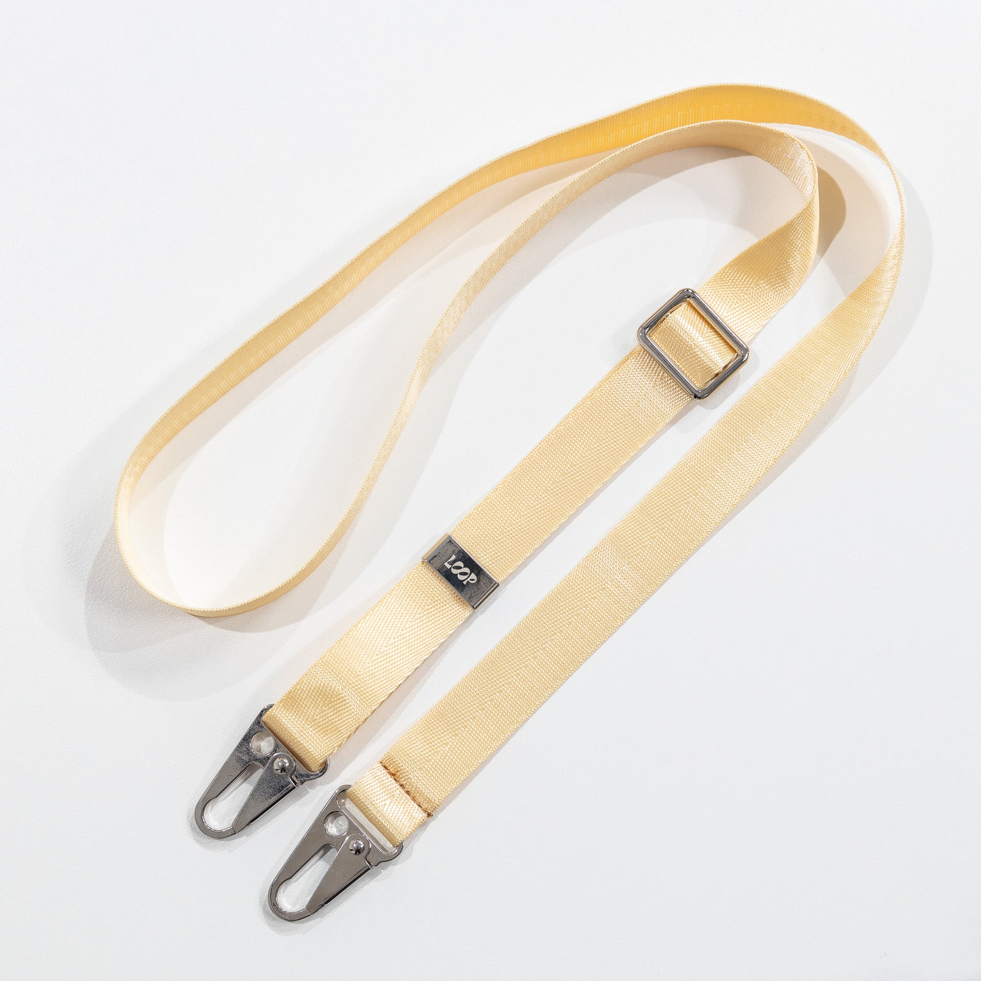 Loop crossbody phone strap butter flat lay