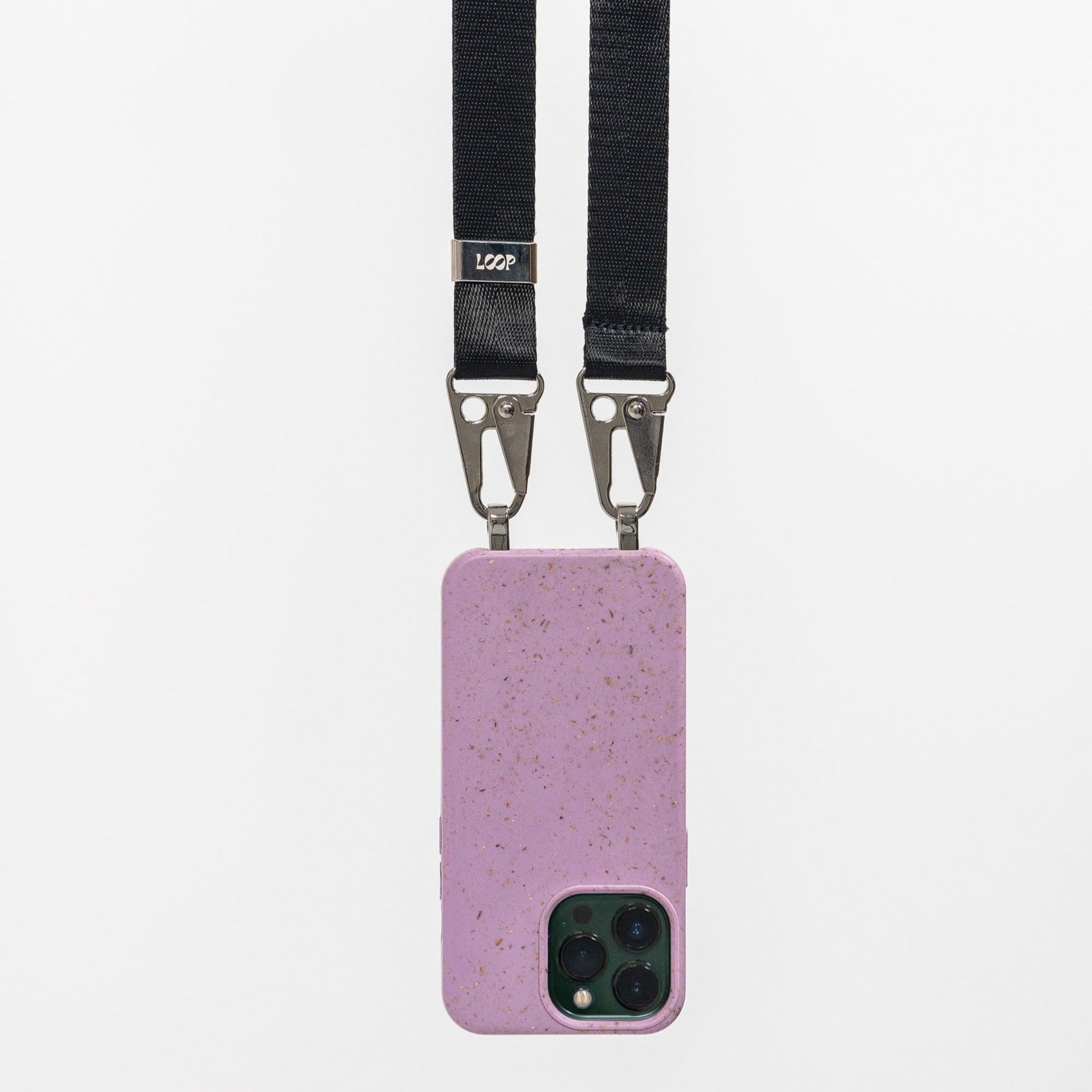 Lavender cossbody phone case with black strap hanging from the back