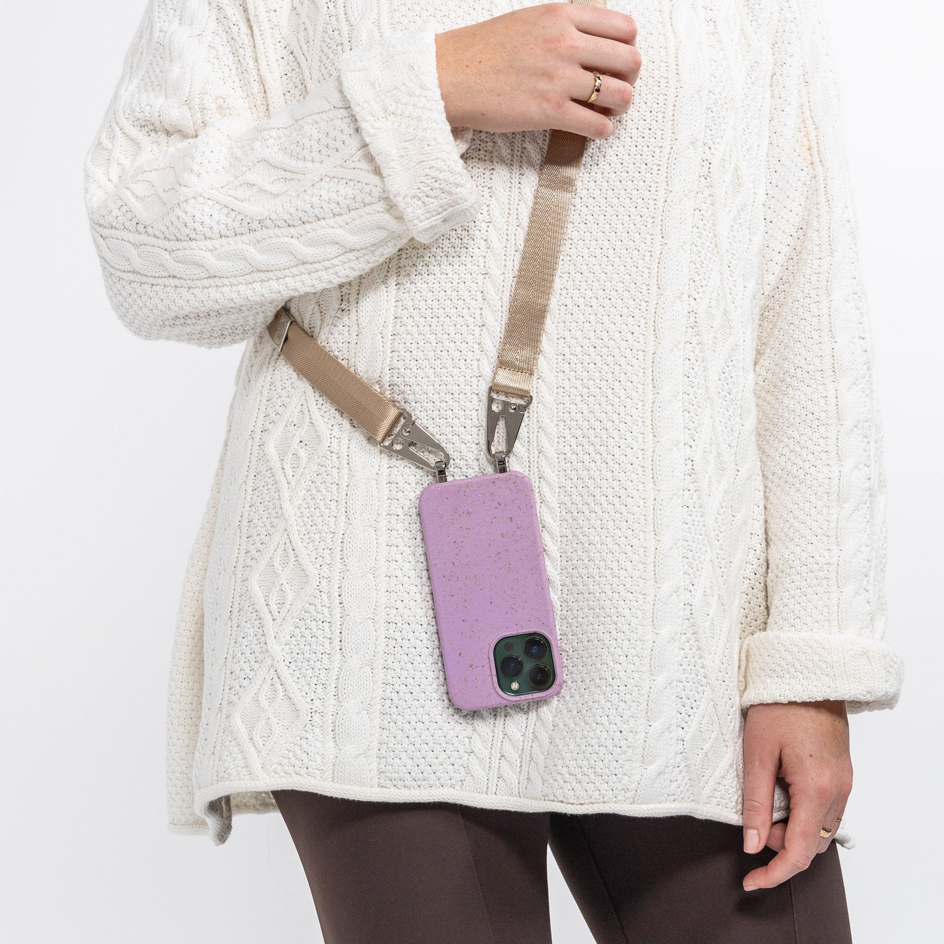 Lavender Loop crossbody phone case with latte phone strap being work over shoulder