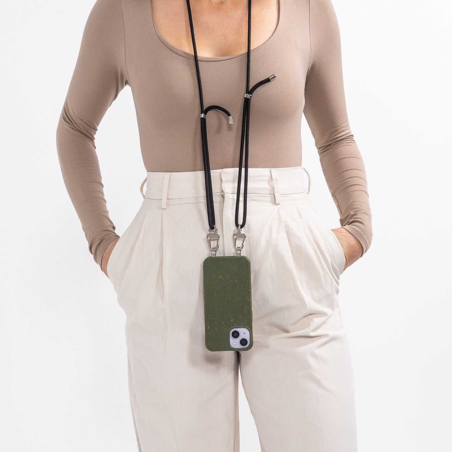 Loop pesto crossbody phone case with black cord being worn around neck